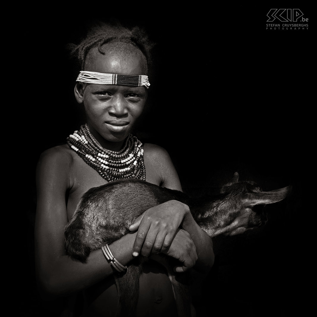 Omorate - Dassanech girl with small goat  Stefan Cruysberghs